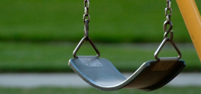 Two girls, an Uzi, and a playground